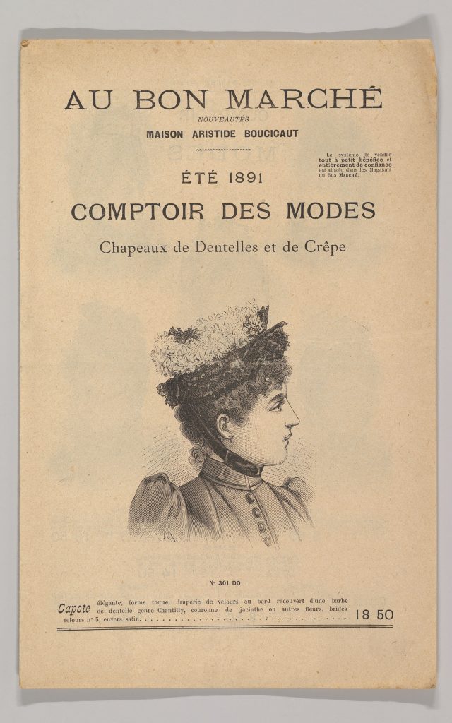 An engraved advertisement hats featuring a sketched profile of a high-class woman sporting a flowery hat.