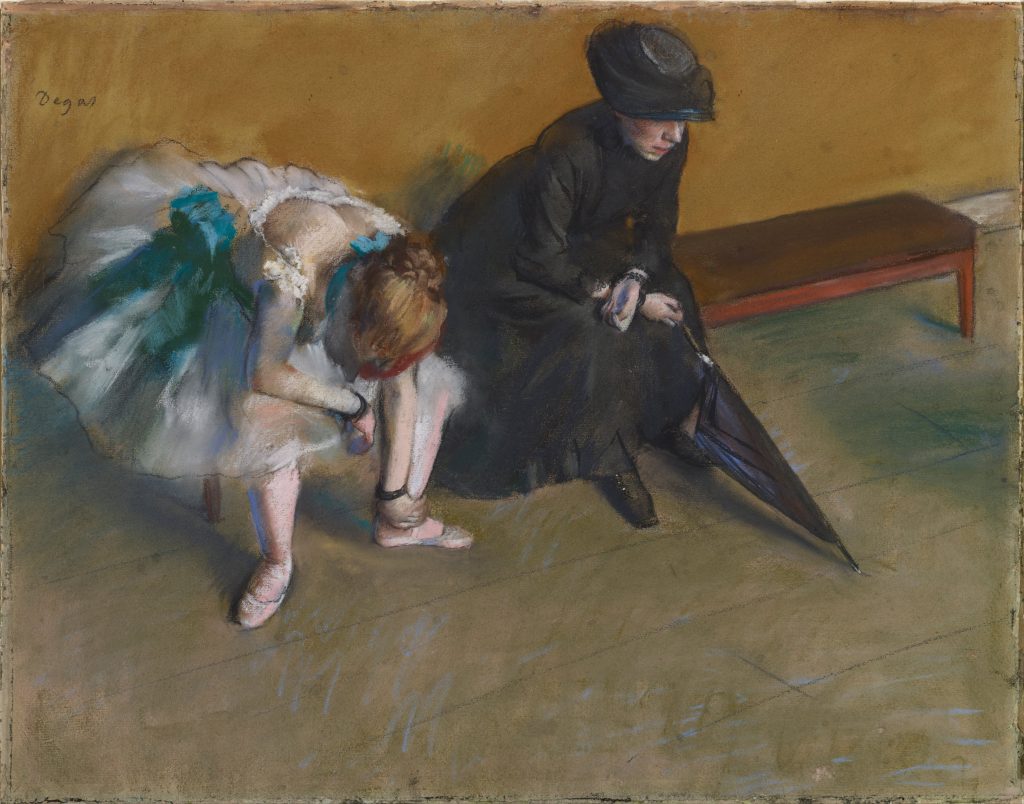 On a brench before a uniform brown background, a downtrodden ballet dancer eyes the floor. By her side, a formal woman in a black dress holds an umbrella, her face covered by a hat.
