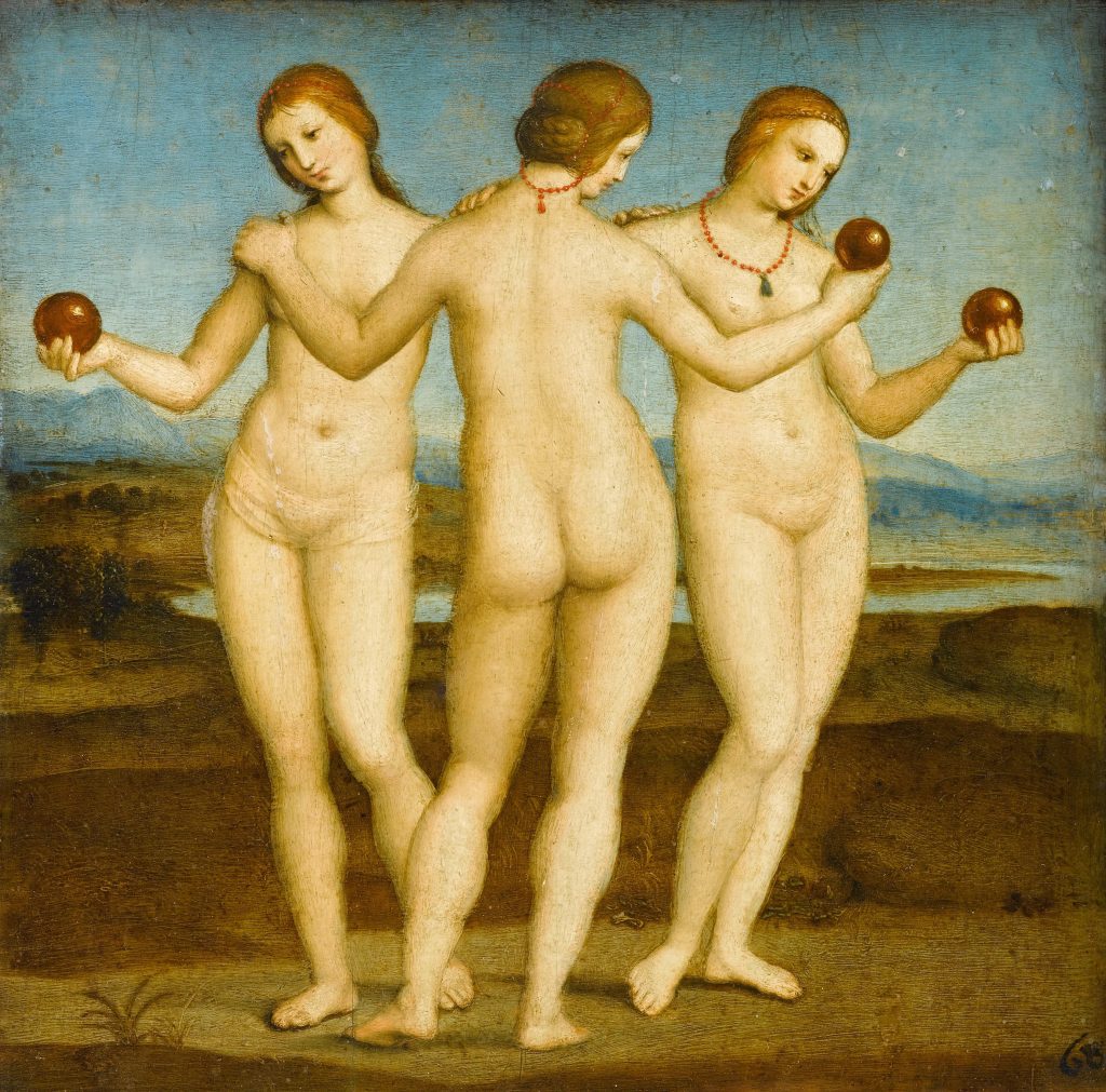 Three nude women hold each other in a circle, each clutching an apple. A valley landscape is painted behind them.