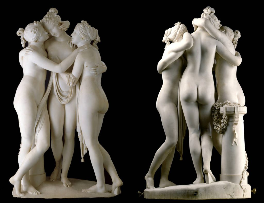 The three nude graces, now thinly veiled by a cloth, embrace each other, sculpted from marble.