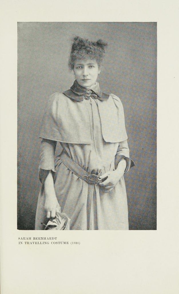 An etched photograph lines page 343; a young woman in a formal dress coat clutches a bouquet of flowers. 'Sarah Bernhardt in travelling costume (1880)'.