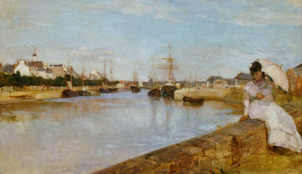 A woman in a white dress, hodling a parasol, sits by an urban canal where many ships are moored.