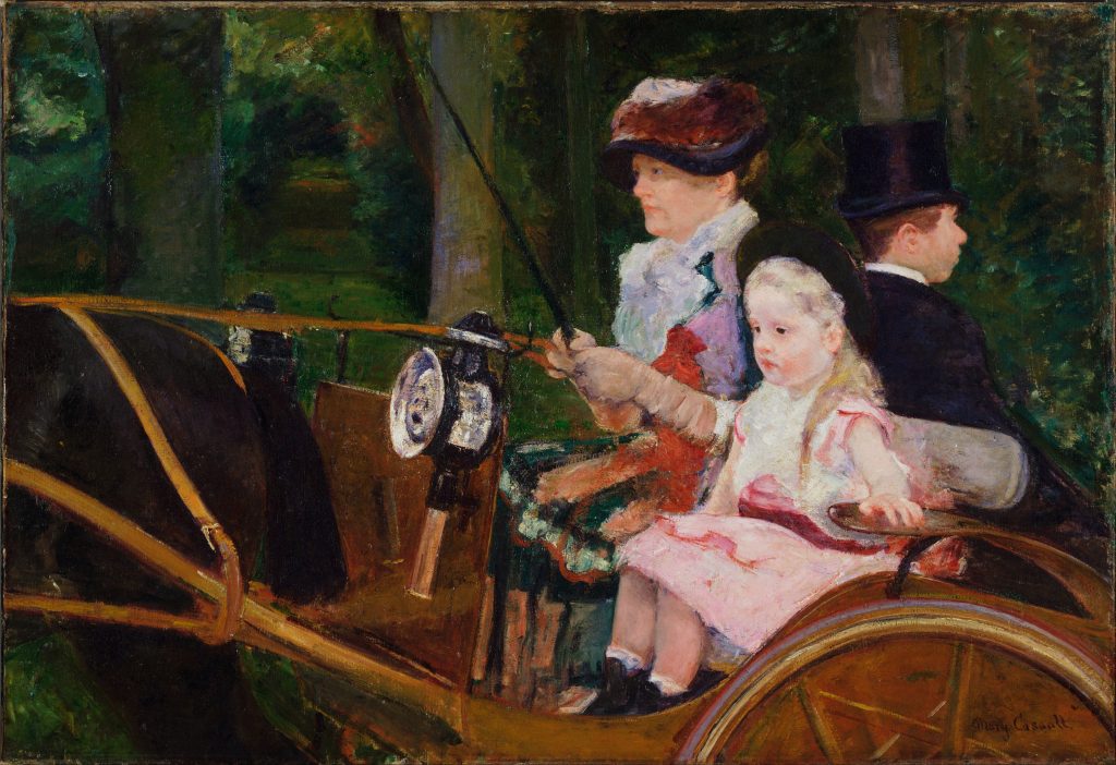 A carriage; carrying a woman, a young girl, and a formally dressed man, is being driven by the former. They pass through a wooded area and are fixated forwards..