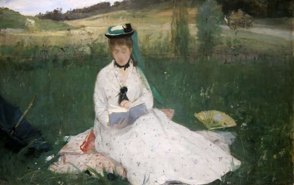 A woman, clad in a white dress and sat in a landscape of fields and greenery, reads a book. Her face is almost entirely obscured by thick paint and a wagon is seen in the background.