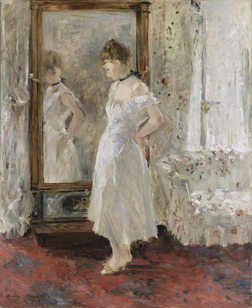 A girl tries on a white dress before a mirror, in a room that reflects the dresses tone. The mirror does not hold the intricacy of the girl's figuration.