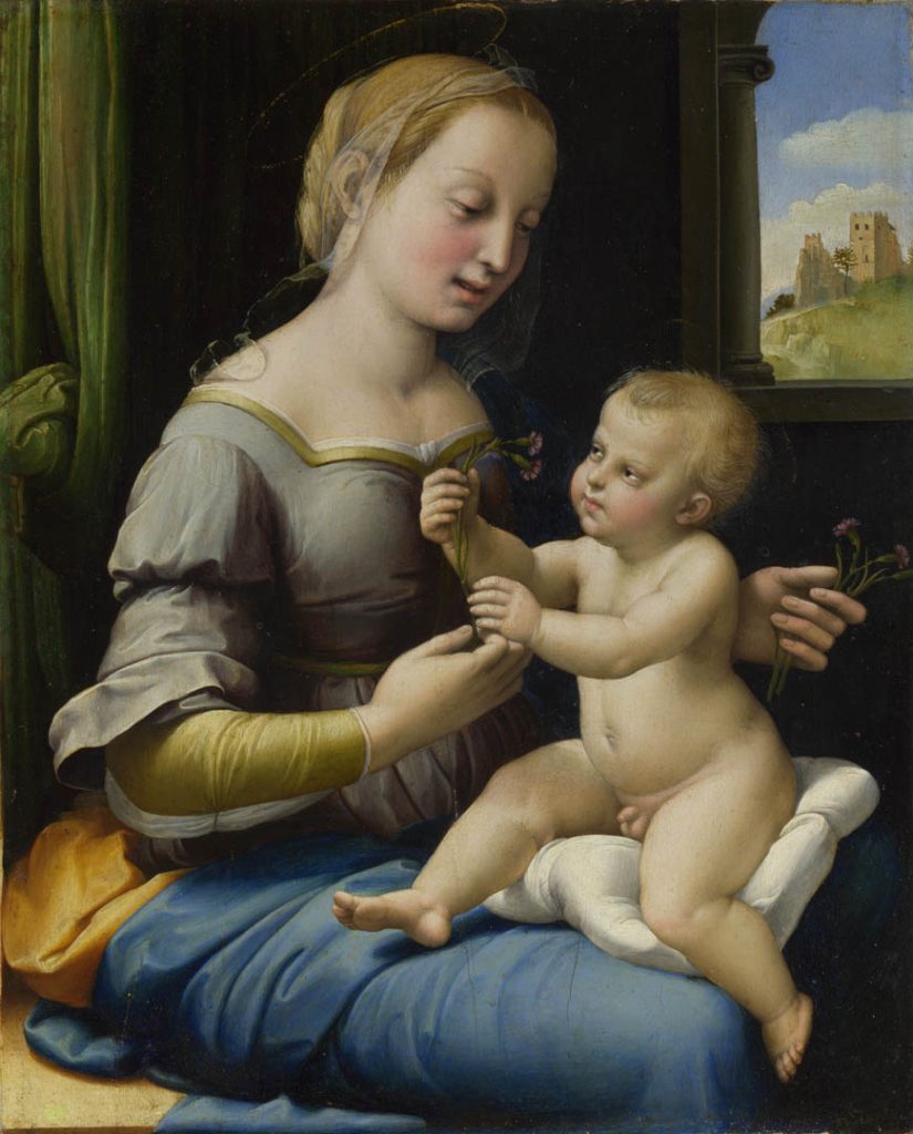 A mother tends to a cherubic child on her lap, both holding purple flowers.