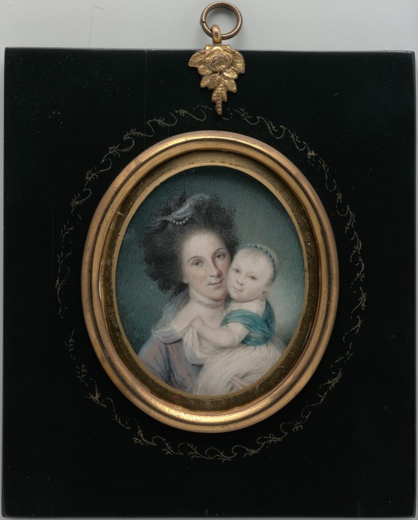 A miniature water-colour portrait of a mother and child, embedded into a broach.