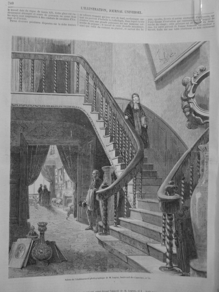 A woodcut engraving print of a home interior where photographs line the walls. A woman desends a large staircase, onlookers examine the prints.