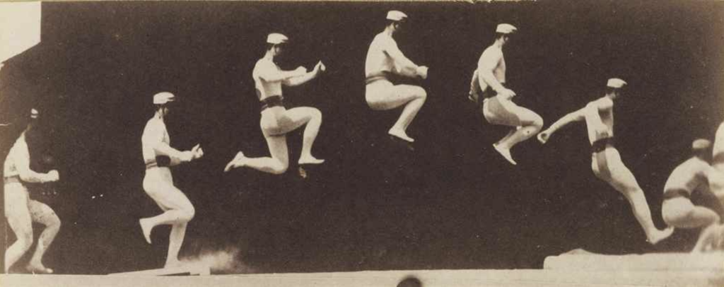 A matte photographic print of an athlete exercising a long jump, multiple phases consolidated into one picture.