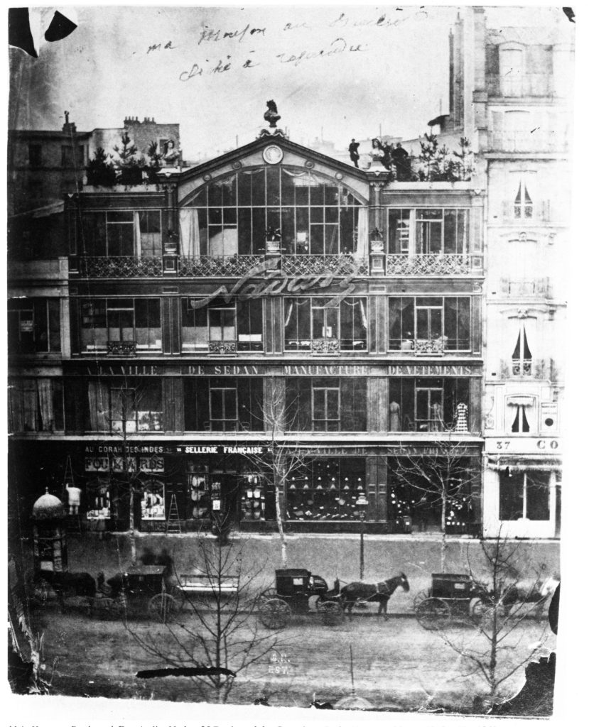 Street-view photograph of Nadar's extensive studio; befet with large glass windows.