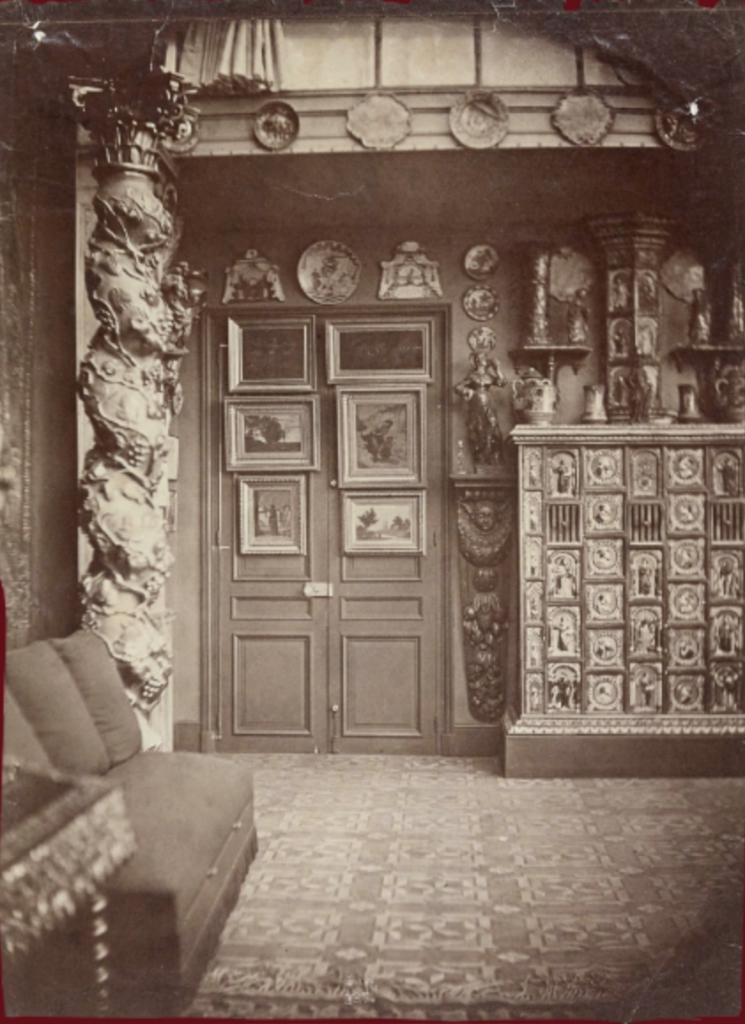 Interior room corner littered with photographic prints. A silver print photograph itself.
