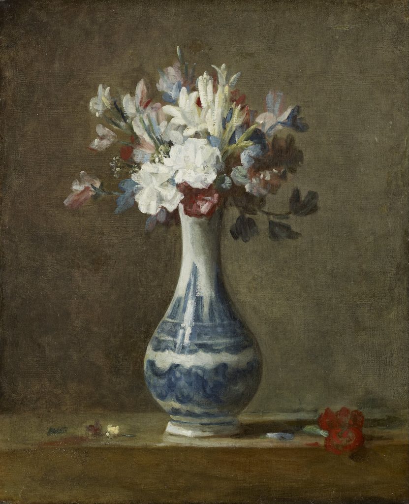 An expanding vase of flowers, made up of cool blues and whites.