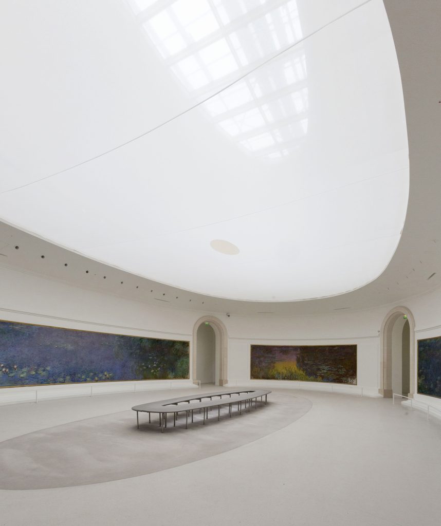 A room of the exhibition where a large skylight floors the room with light.