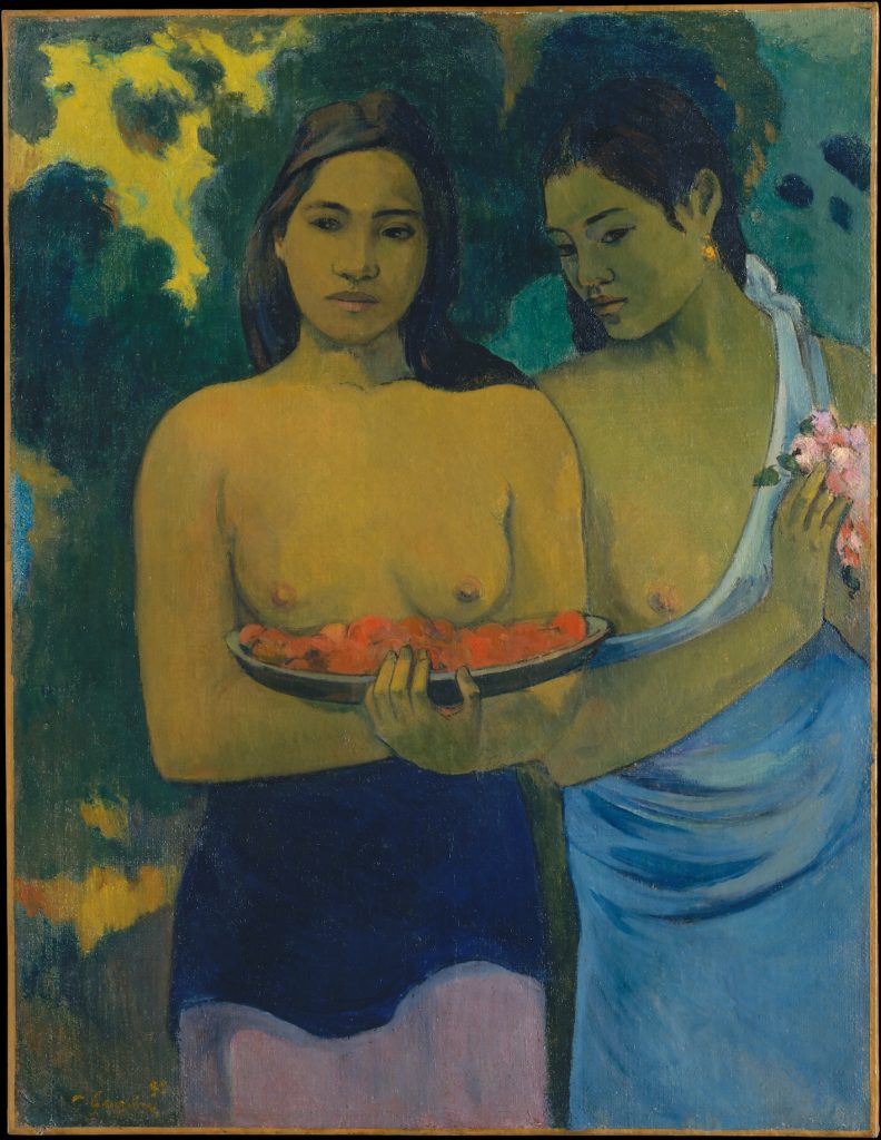 A portrait of two indigenous woman carrying fruit and flowers, both top-less. There's a verdant backdrop of greenery.