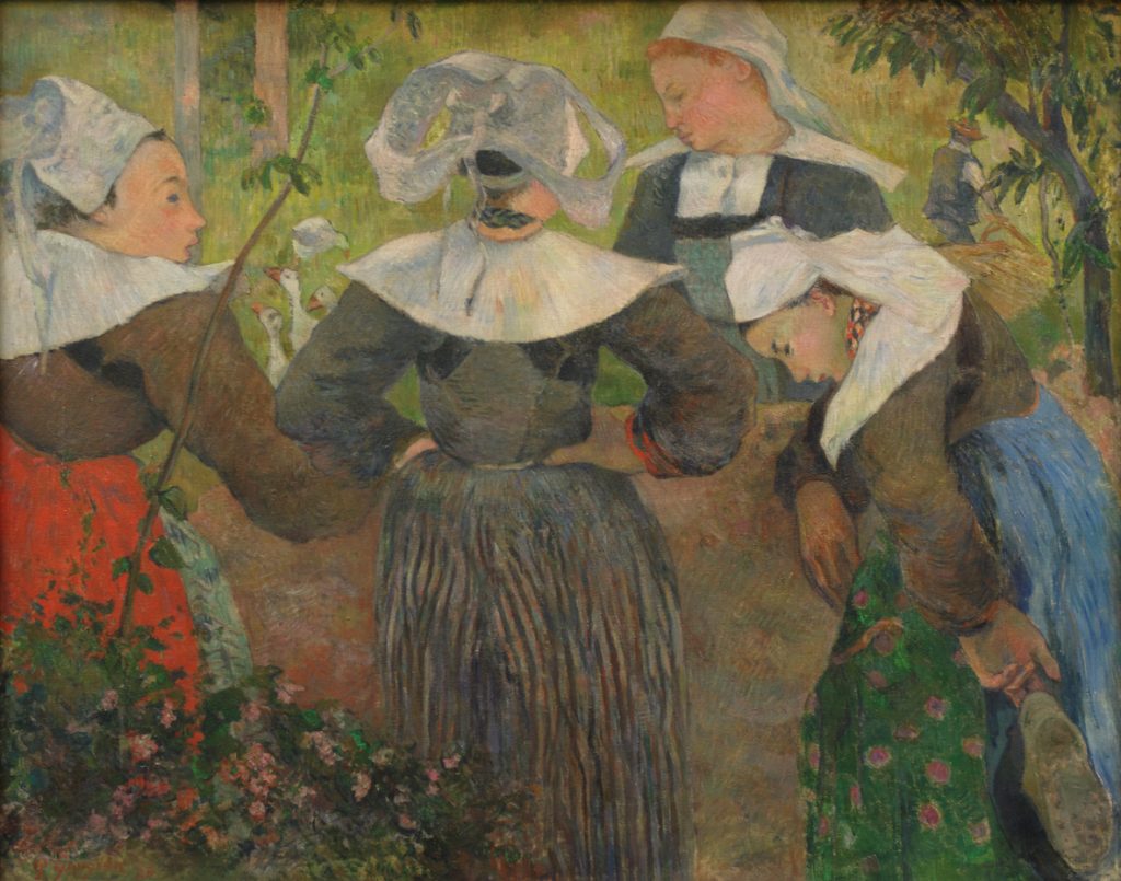 A circle of four woman in conservative black and white dress, placed in a forested setting. There are geese, and a kneeling farmer, in the background.