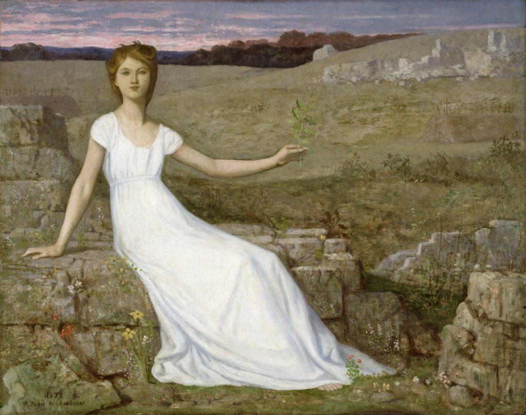 A white gowned woman sits on stone ruins, presenting a flower in her hand.