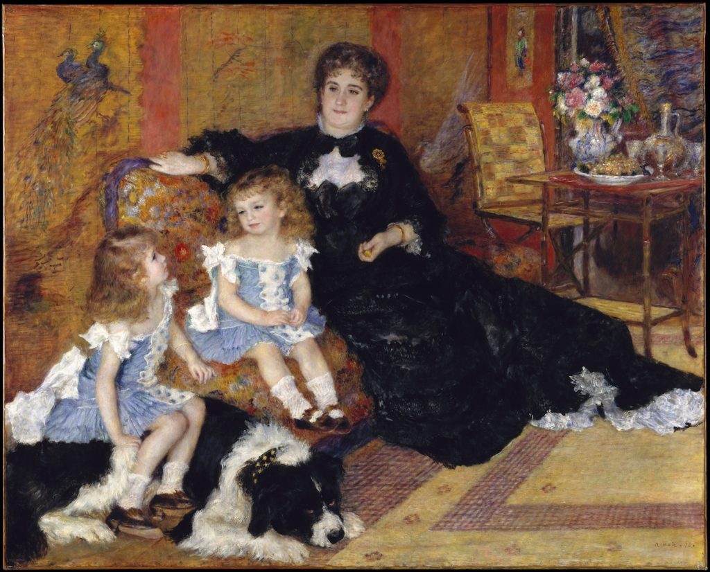 A woman in a fancy black dress oversees her two girls clad in blue dresses and their large dog. They are seated in a warm-toned yellow room.