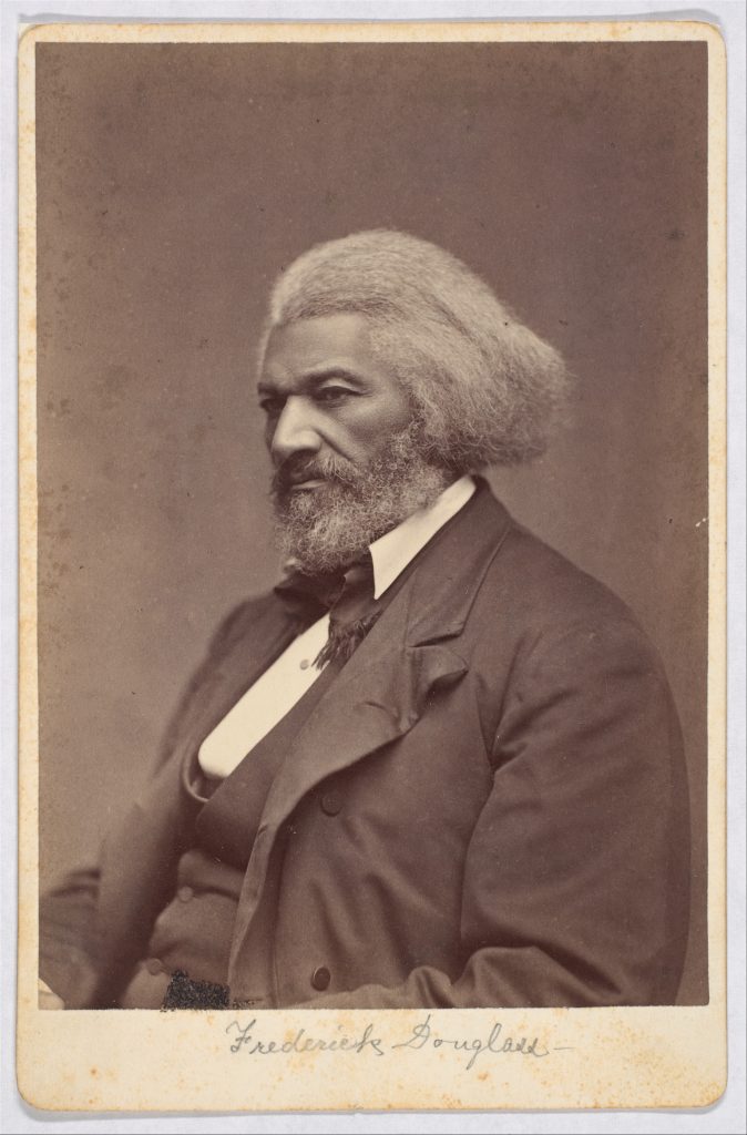 A silver print photographic portrait of an older Frederick Douglass contemplatively looking to the left.