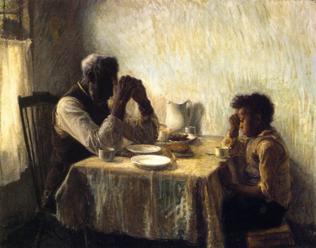 An older black man and a young black boy, sat at an interior dinner table, pray before eating. The painting is made in dewy long paint strokes.