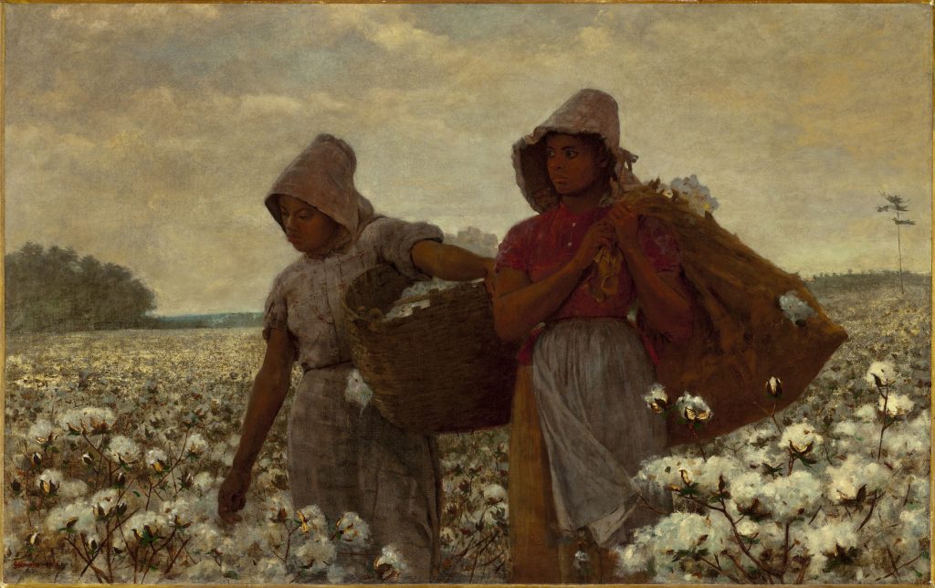 Two black women stand in a field of cotton before a light cloudy sky. One, clutching her bag, stares stoically to the left.