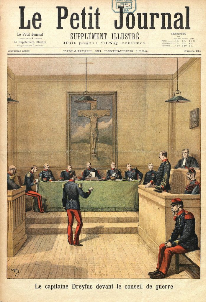 A journal cover picturing a print depiction of Dreyfus placed before a uniformed tribunal, on the stand.