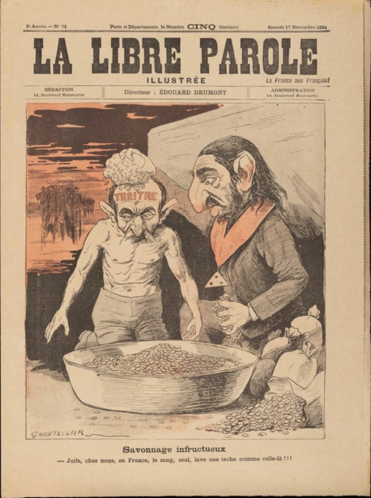 A caricature print picture of one jewish stereoype bathing a second one, who was "TRAITOR" inscribed on his forehead. Both are grotesquely distorted, straying away from human proportions.