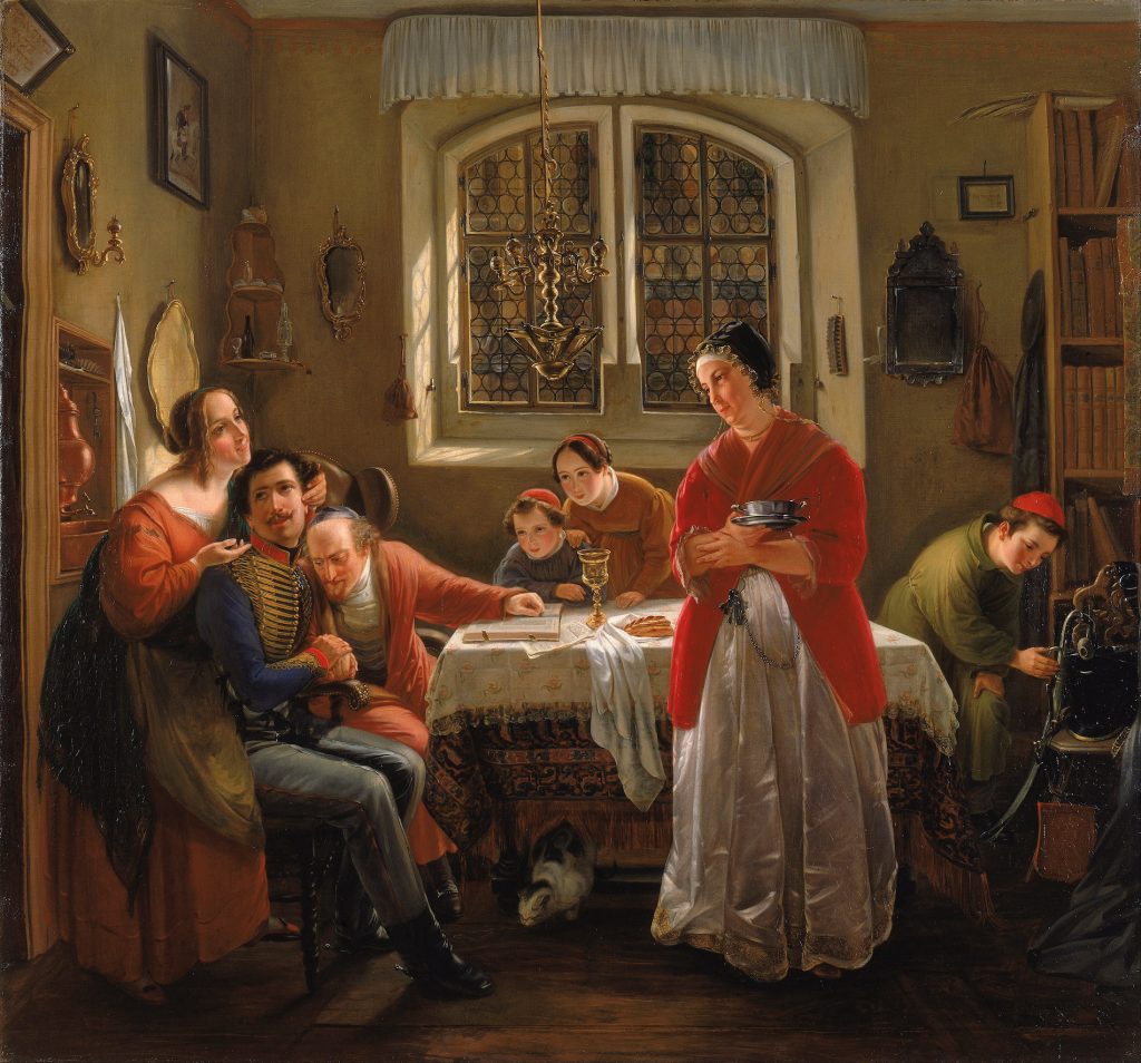 A warm interior scene of a jewish family, heads covered, embracing a man in a soldier's uniform at the diner table.