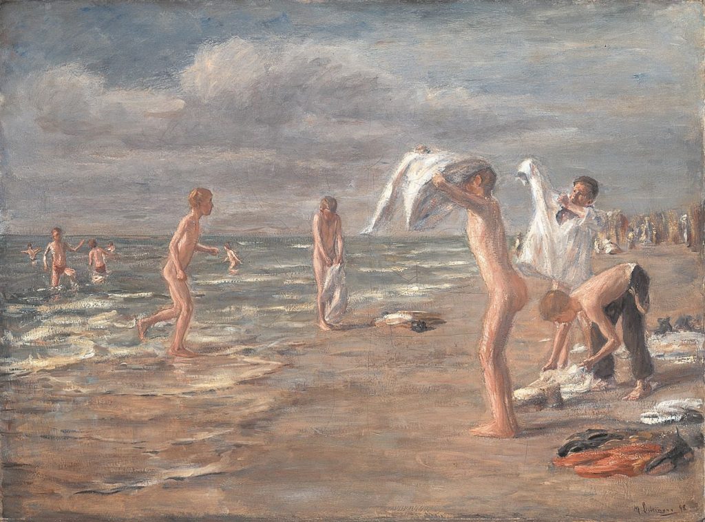 A beach scene of young boys disrobing before the ocean, throwing their clothes to the sand.