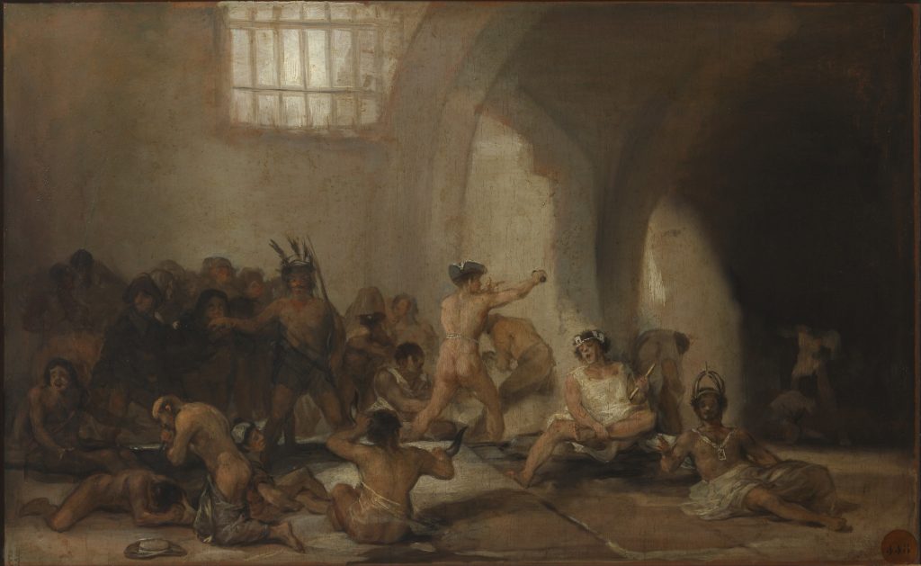 Indoors of a prison where men, mostly nude, clump together and are depicted re-enacting various mythological or historical poses.