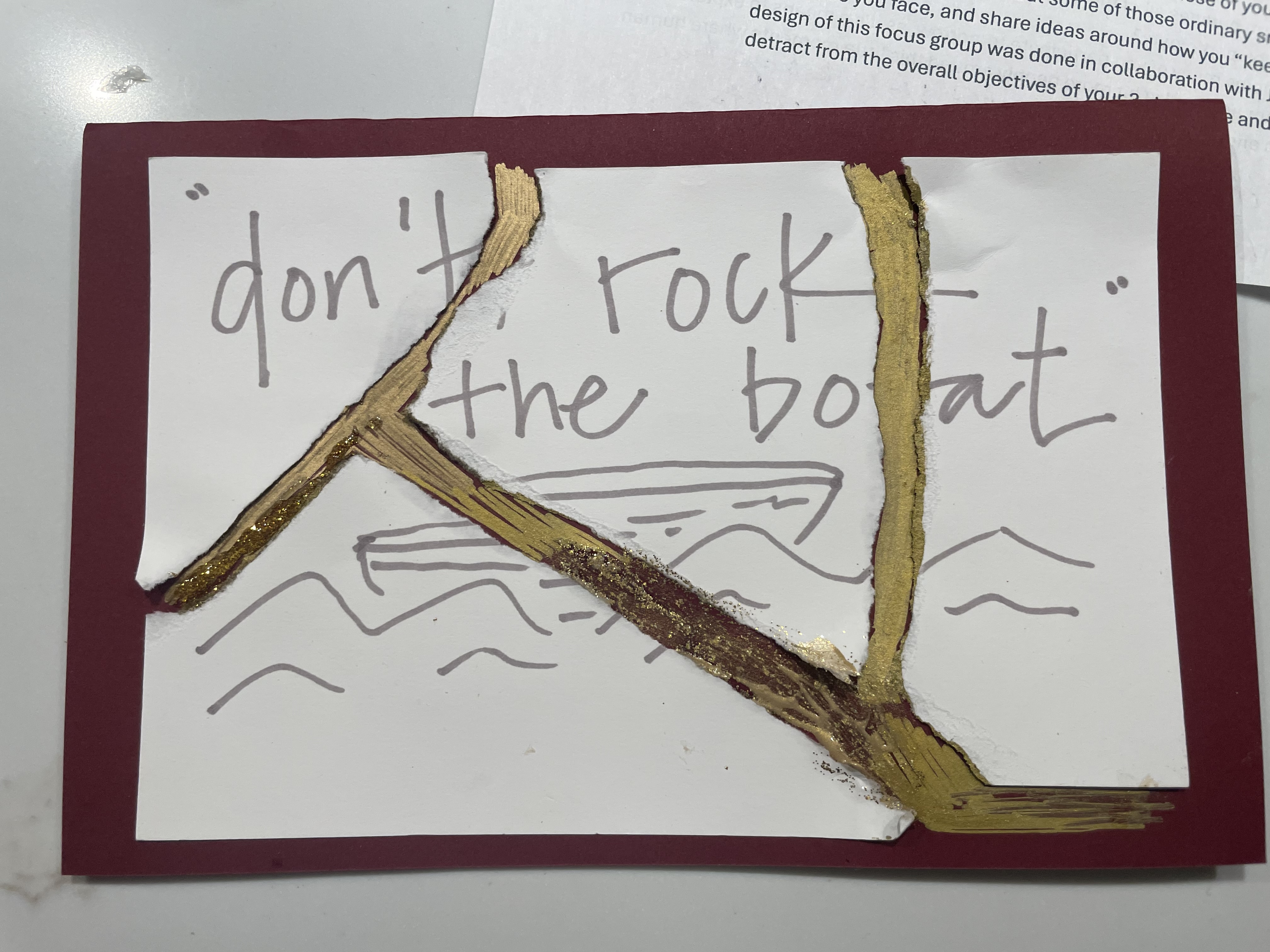 The example response ripped up and repaired by glueing onto carstock and painting the cracks with gold.