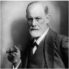 Sigmund Freud holding a cigar while looking at the camera