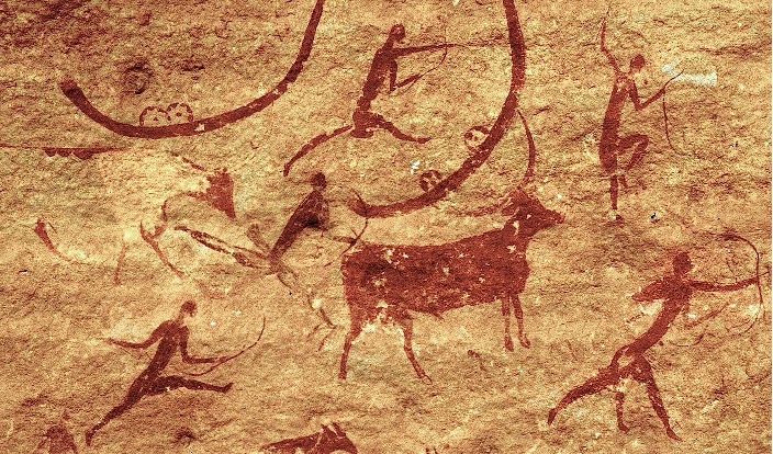 Rock art depicting people hunting.