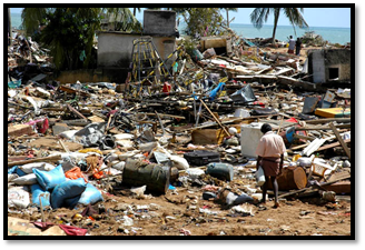 Man walking among destruction resulting from tsunami.