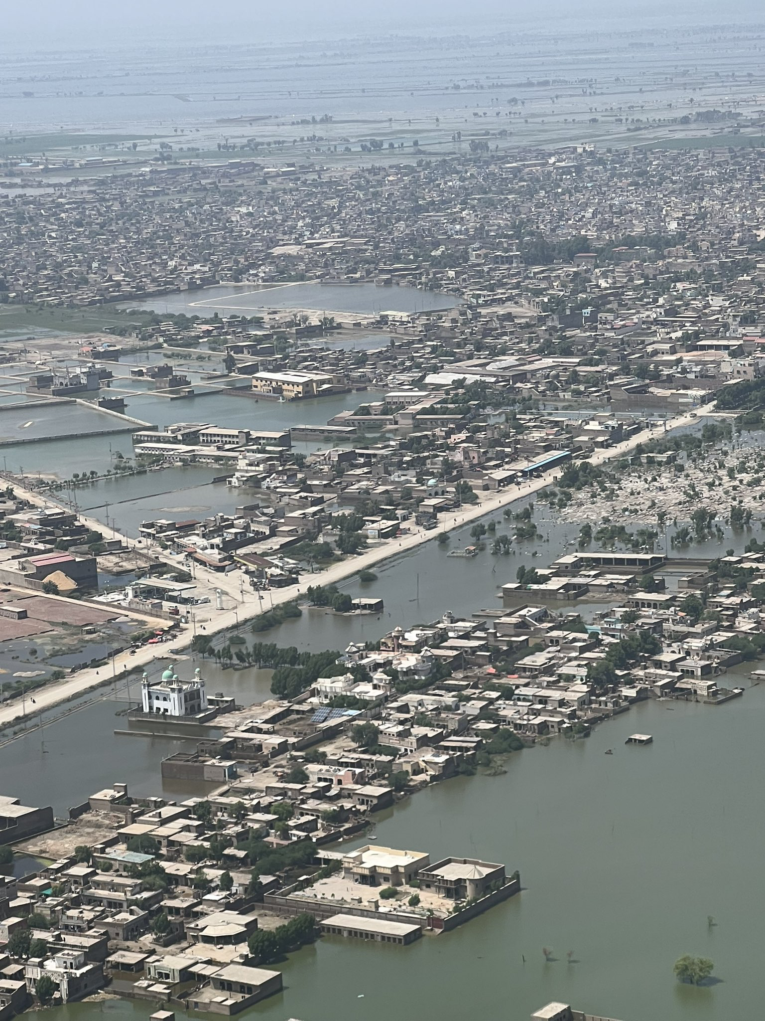 Aerial photograph of a flooded city.