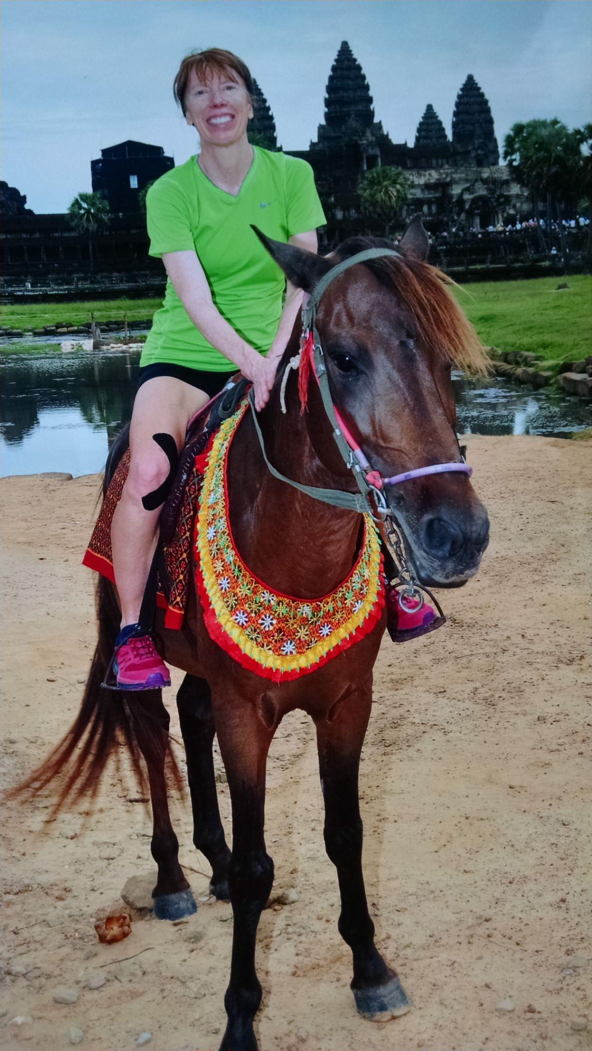 Author Joylin Namie riding a horse.